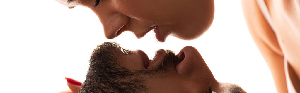 panoramic shot of attractive woman kissing handsome man, isolated on white - Photo, Image