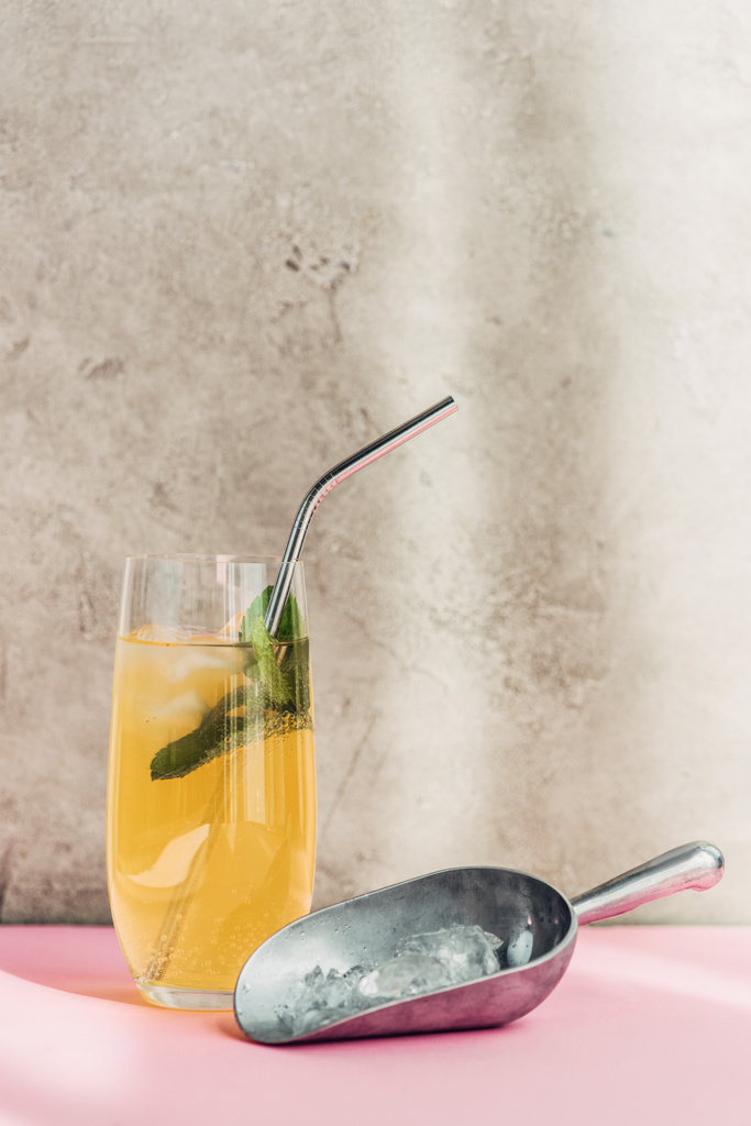 fresh lemonade with ice, mint, straw near ice scoop in sunlight - Photo, Image