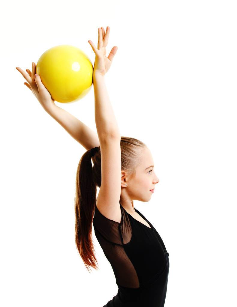 Flessibile carina bambina ginnasta facendo esercizio acrobatico
 - Foto, immagini
