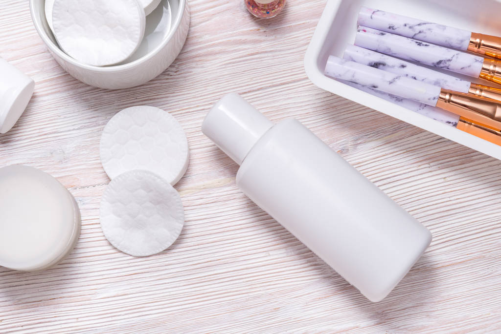 Set of plastic bottles for cream or face lotion on wooden table - Photo, Image