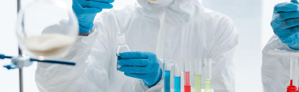 panoramic shot of scientists in latex gloves doing dna test in lab  - Photo, Image
