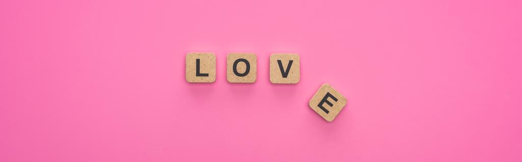 top view of love lettering on wooden cubes on pink background, panoramic shot - Photo, Image
