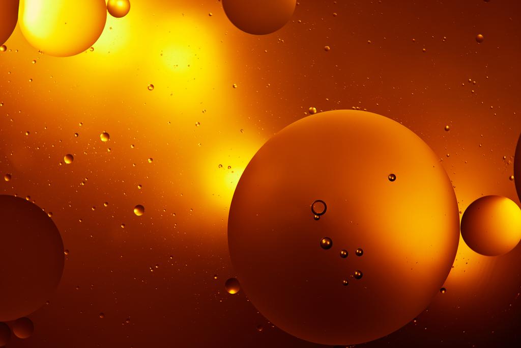 Beautiful orange color abstract background from mixed water and oil  - Photo, Image