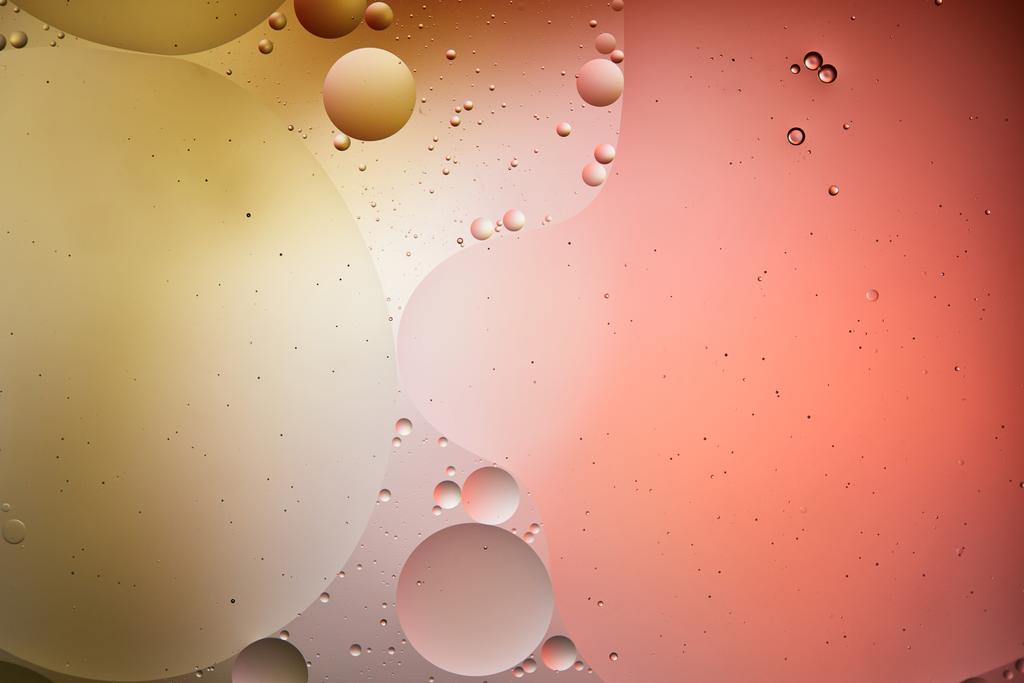 creative abstract background from mixed water and oil bubbles in red and yellow color - Photo, Image