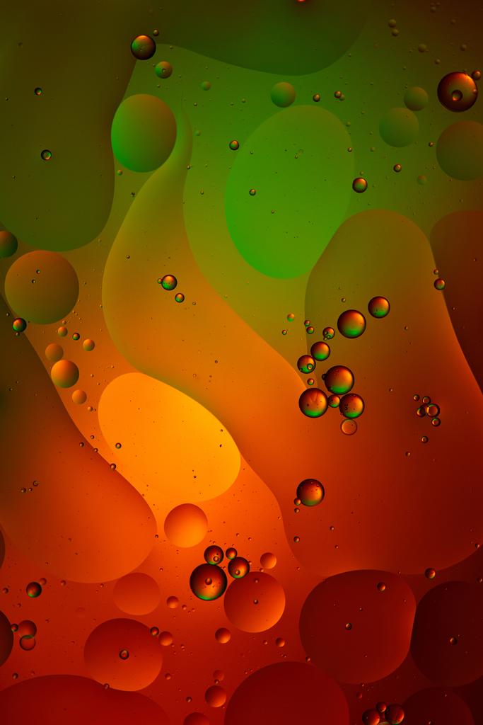 green and red color abstract background from mixed water and oil bubbles   - Photo, Image