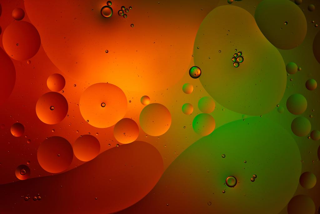 abstract green and red color background from mixed water and oil bubbles  - Photo, Image
