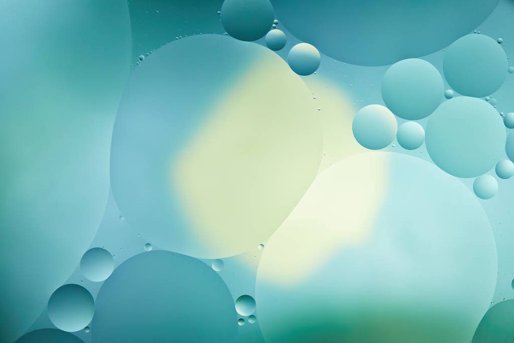 Beautiful abstract background from mixed water and oil in turquoise color - Photo, Image