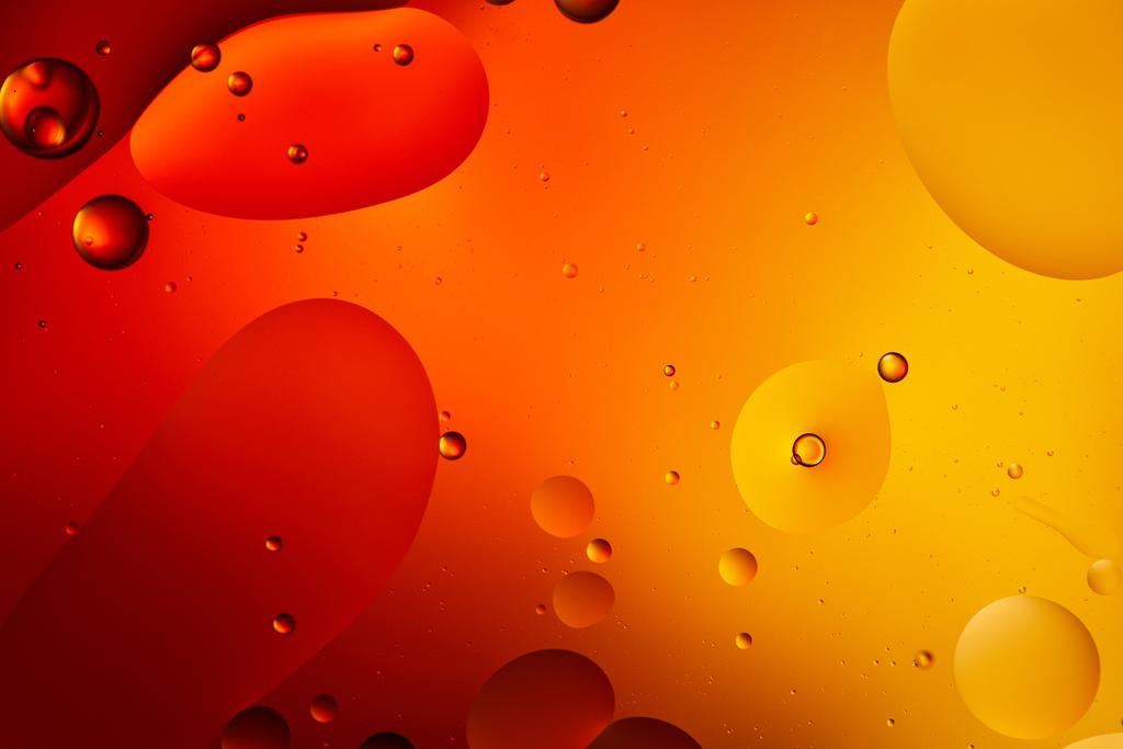 Красивый абстрактный фон из смешанной воды и масла в оранжевом цвете
 - Фото, изображение