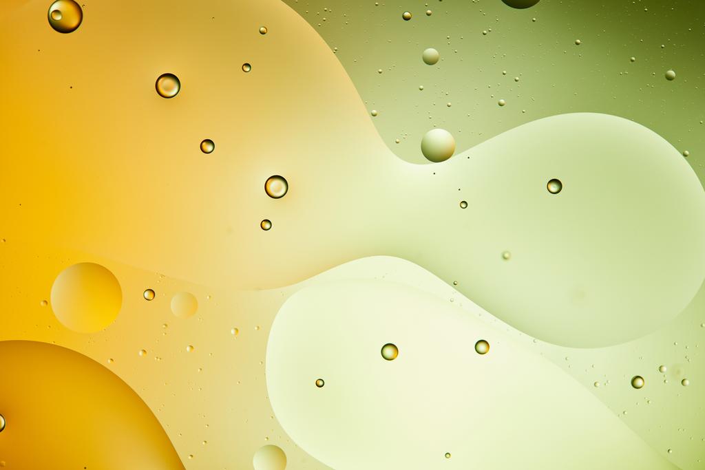 schöne grüne und orangefarbene Farbe abstrakten Hintergrund aus gemischtem Wasser und Öl - Foto, Bild