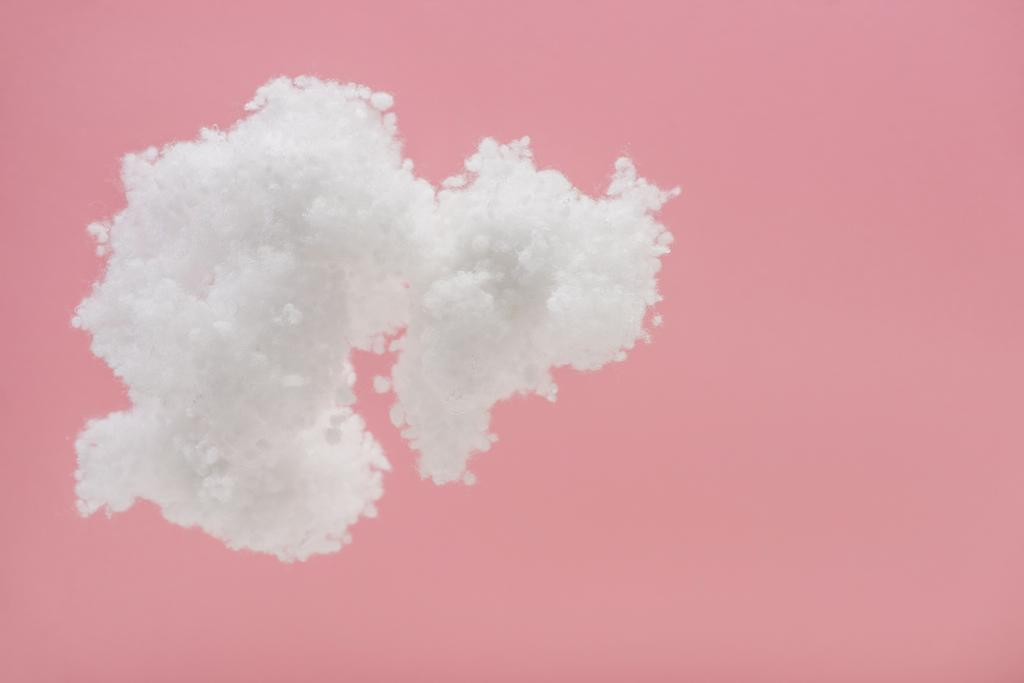 white fluffy cloud made of cotton wool isolated on pink - Photo, Image