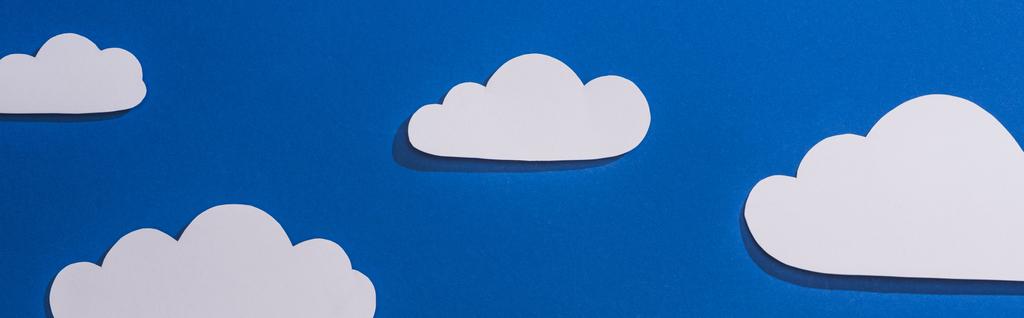 top view of white paper cut clouds on blue background, panoramic shot - Photo, Image
