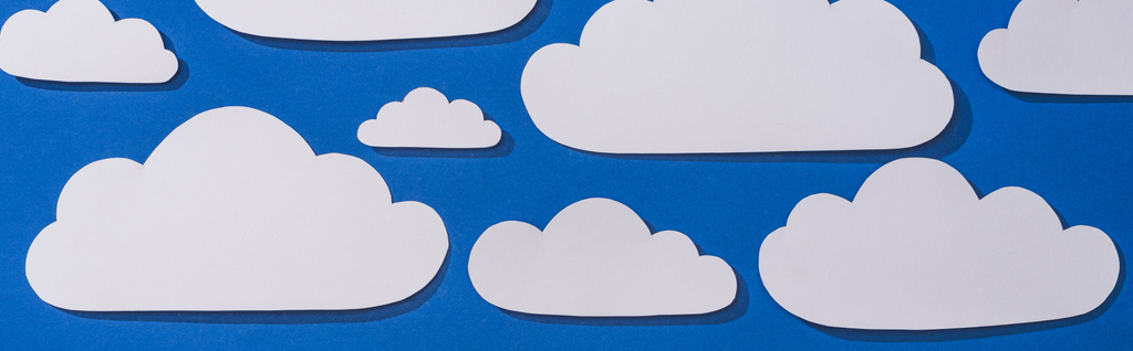 top view fehér papír vágott felhők kék háttér, panoráma lövés - Fotó, kép