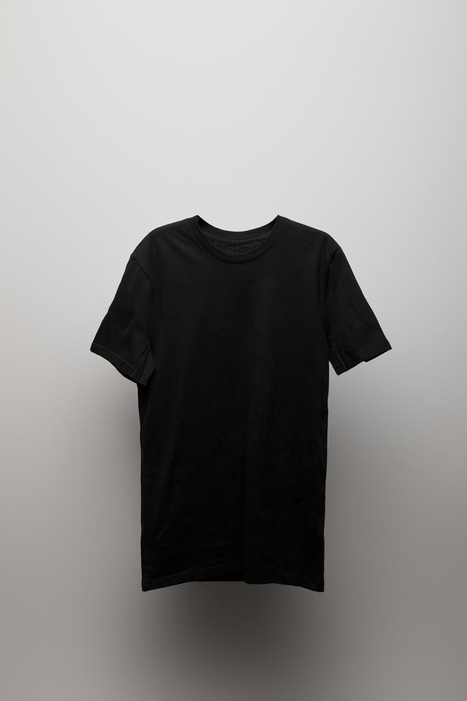 blank basic black t-shirt on grey background - Photo, Image