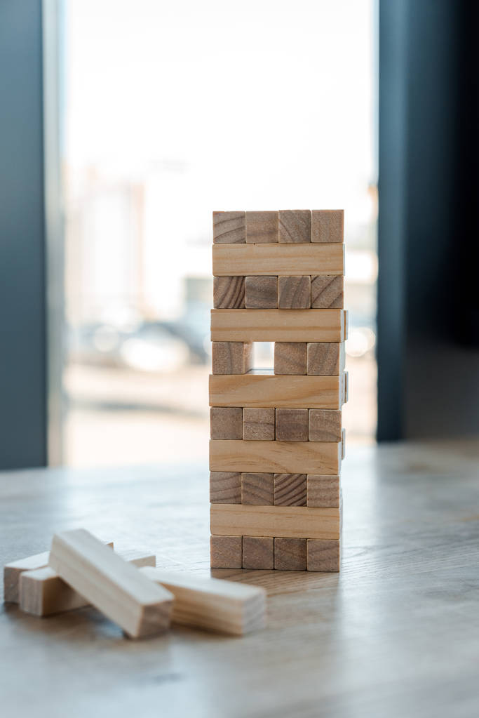 KYIV, UKRAINE - NOVEMBER 22, 2019: selective focus of blocks wood tower game on desk  - Photo, Image