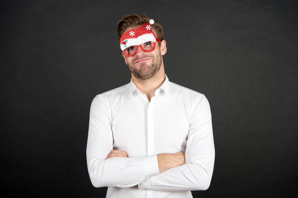 Merry christmas. Man white shirt posing with photo booth props. Santa claus coming. Winter holidays. Corporate party. Guy celebrate new year. Cheerful ideas for holidays celebration. Happy holidays - Photo, Image