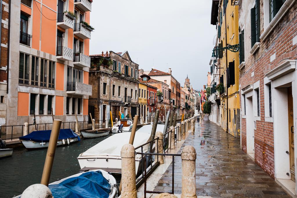 canal, motor boats and ancient buildings in Venice, Italy  - Photo, Image
