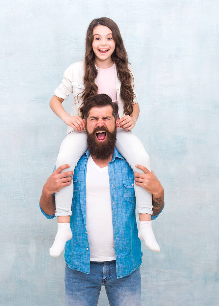 Enjoy the ride. Happy child. Small child and father. Bearded man carry child piggyback. Raising child with love. Happy family have fun together. Good parenting - Photo, Image