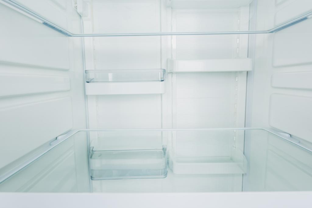 Clean empty shelves in white refrigerator - Photo, Image