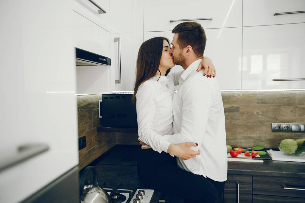 Couple in a kitchen - Photo, Image