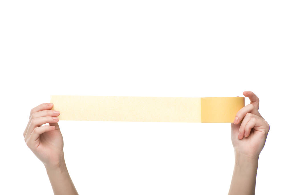 vista recortada de la mujer sosteniendo cinta adhesiva aislada en blanco
 - Foto, imagen