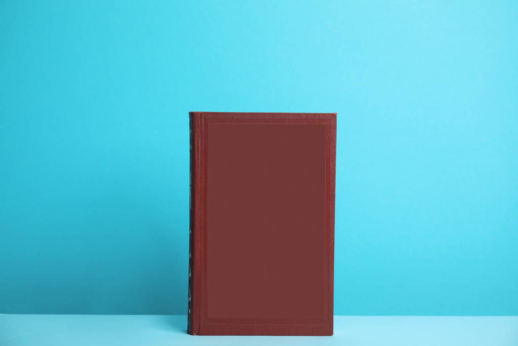 Hardcover book on blue background. Space for design - Photo, Image