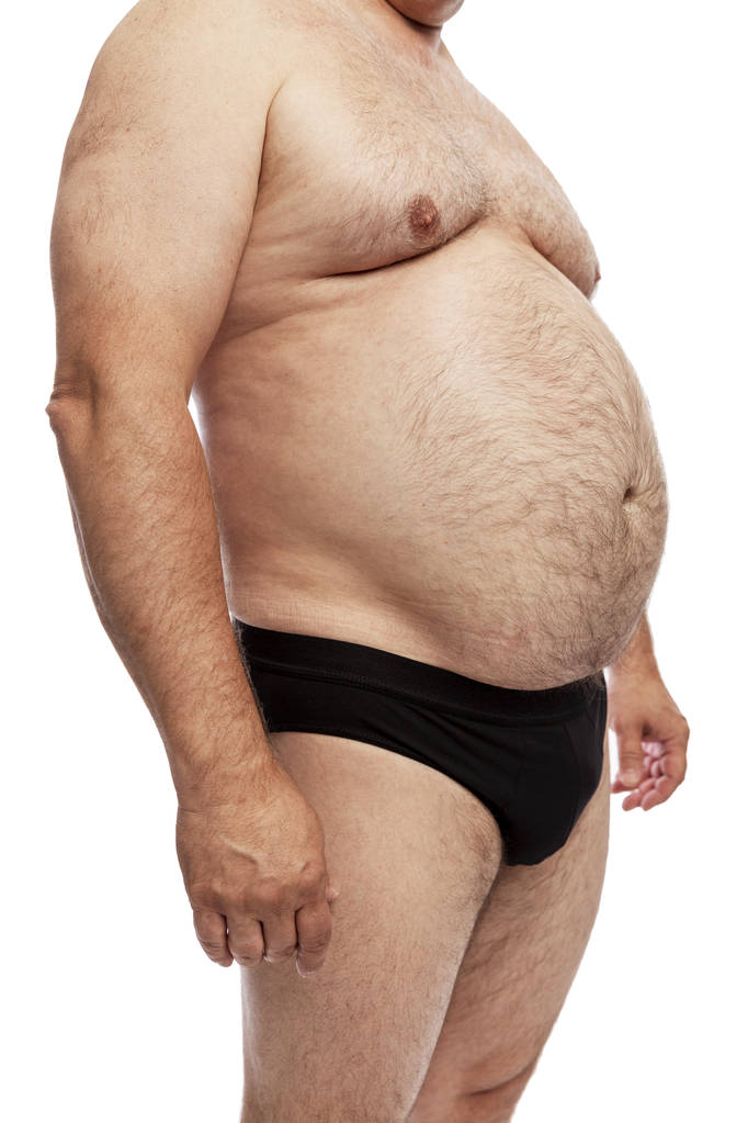 Um homem gordo com uma barriga grande. Vista lateral. Isolado sobre fundo branco
. - Foto, Imagem