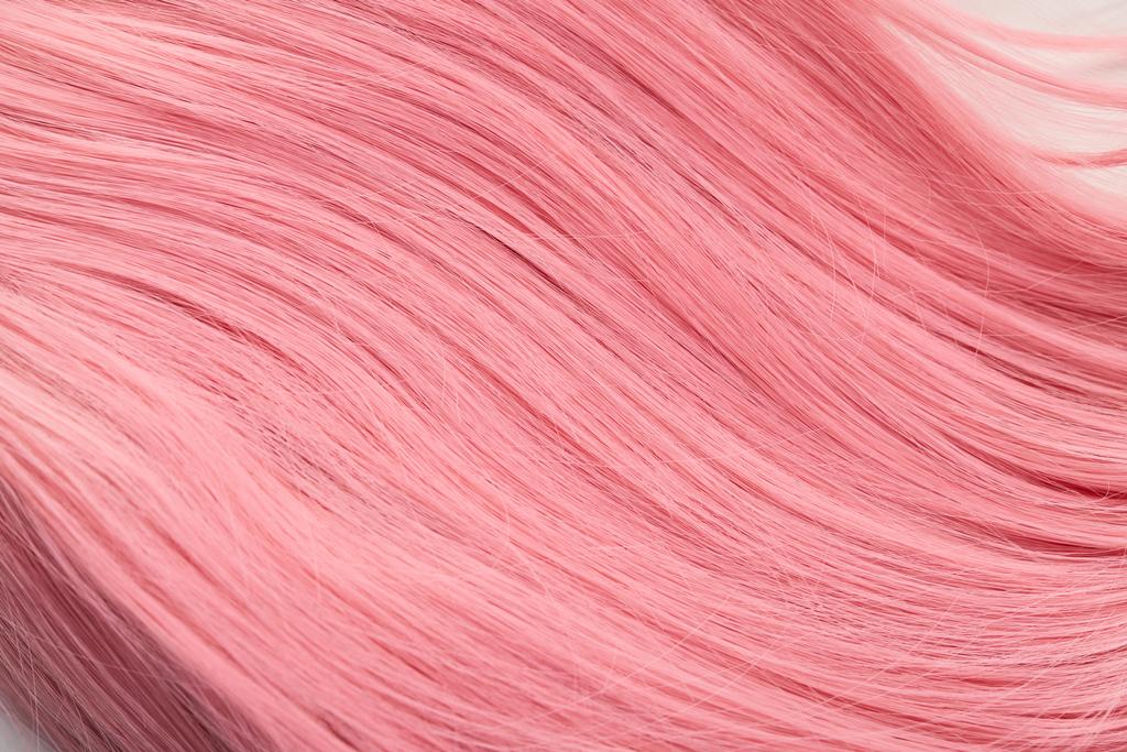 Close up view of pink hair on white background - Photo, Image