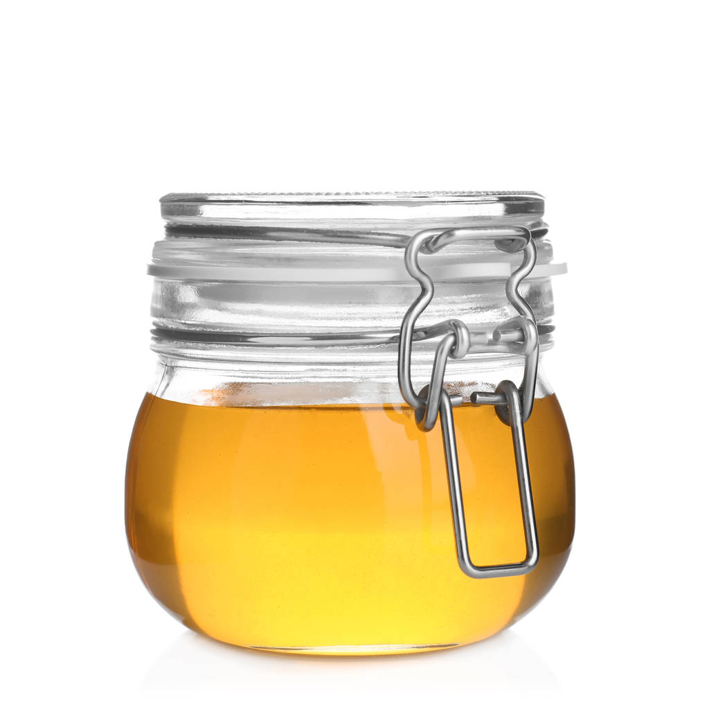 Jar of organic honey isolated on white - Photo, Image