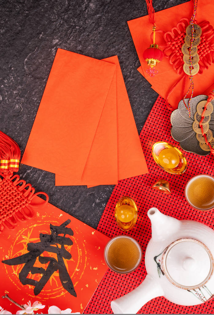 Design concept of Chinese lunar January new year - Festive accessories, red envelopes (ang pow, hong bao), top view, flat lay, overhead above. The word 'chun' means coming spring. - Photo, Image