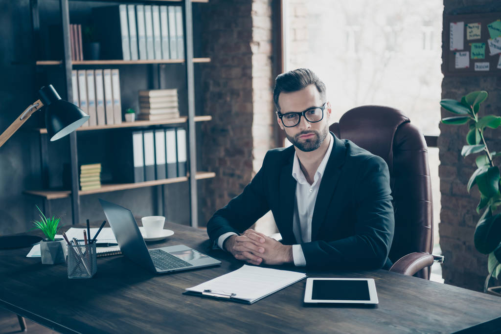 Photo of attentive handsome business guy focused attentively listening vacancy candidate asking interview questions wear specs black blazer shirt suit sitting chair office indoors - Photo, Image