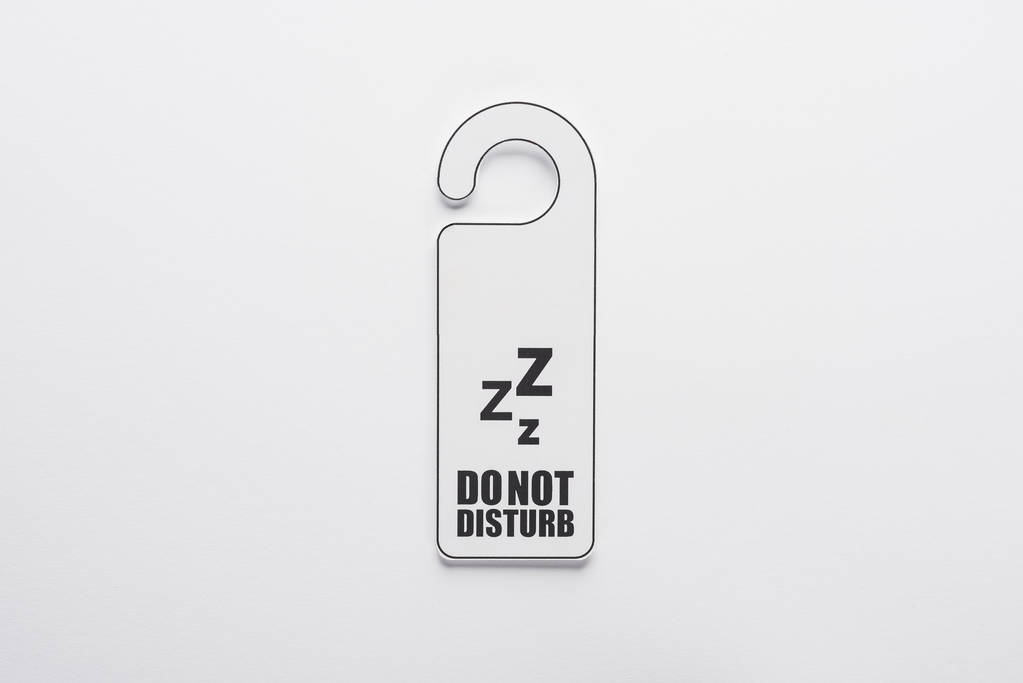 top view of do no disturb sign on white background - 写真・画像