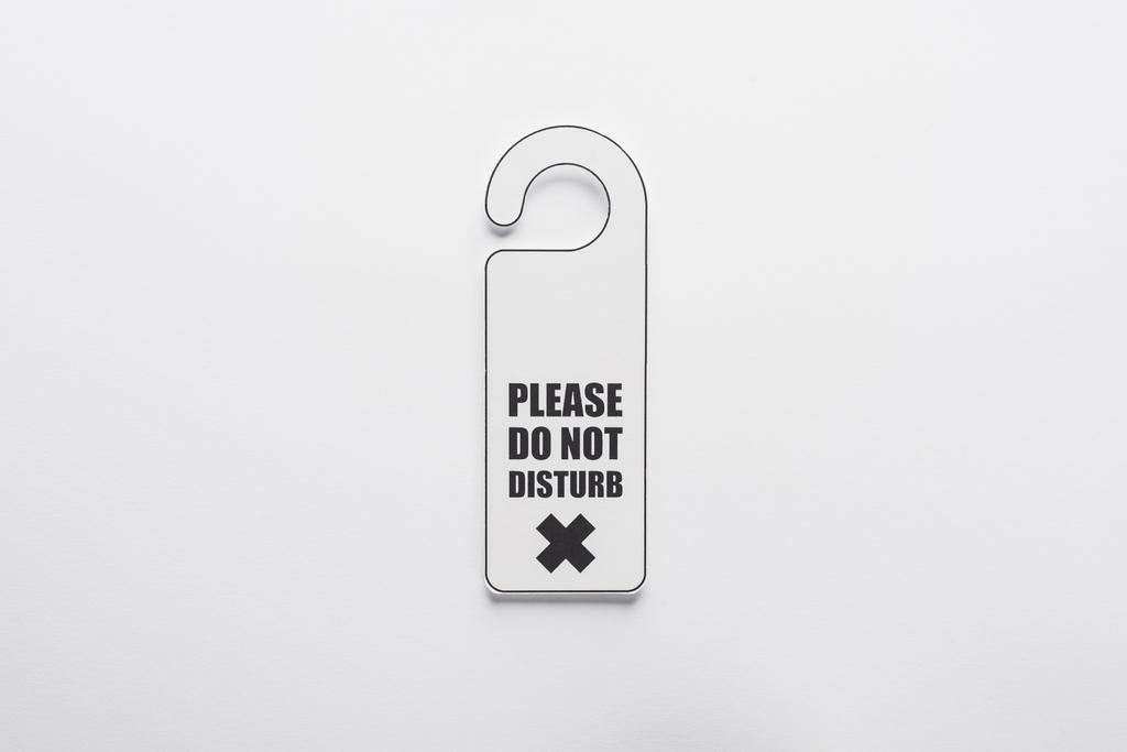 top view of please do no disturb sign on white background - 写真・画像
