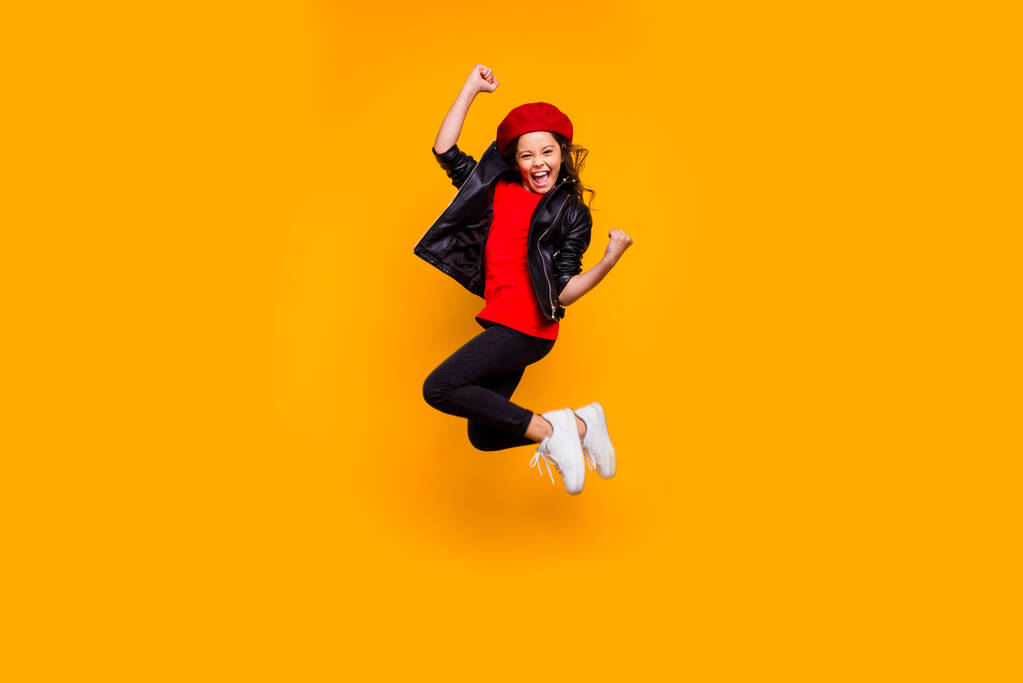 Full length body size view of her she nice attractive trendy cheerful cheery funky brunette wavy-haired girl jumping rejoicing having fun isolated on bright vivid shine vibrant yellow color background - Photo, Image