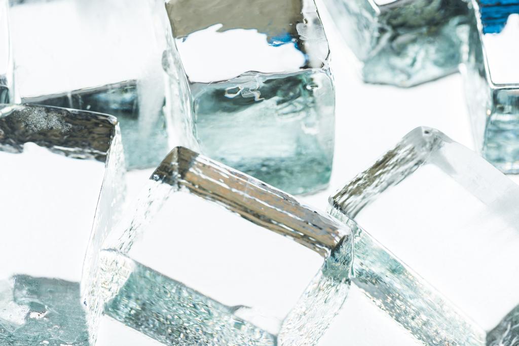 close up view of melting transparent clear square ice cubes - 写真・画像