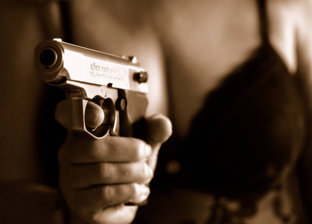 hand with pistol,in sight - Photo, Image