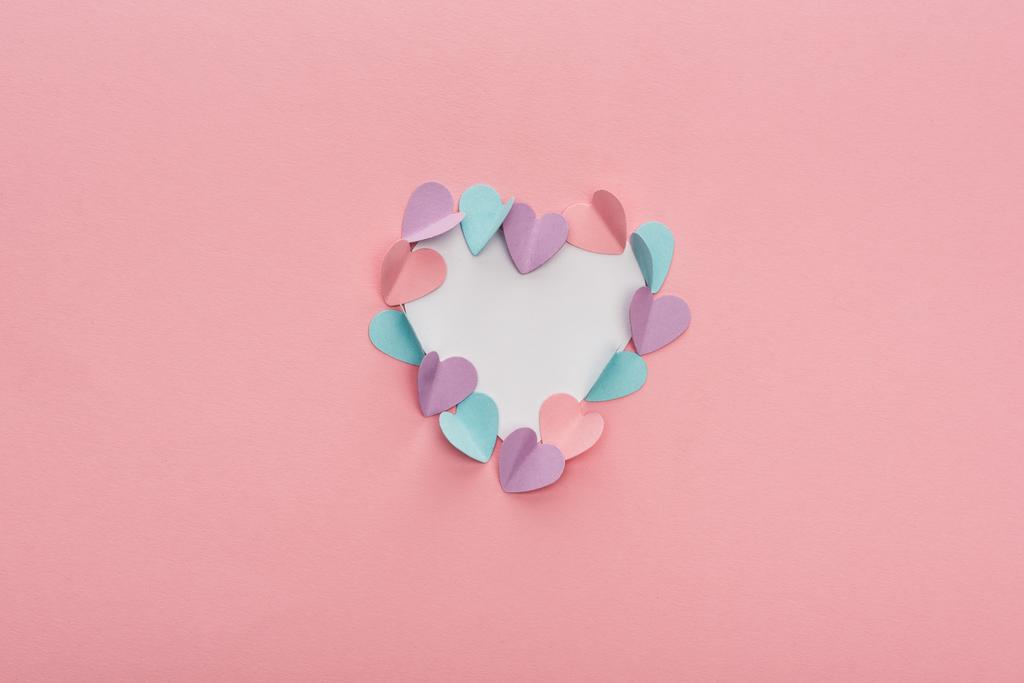 top view of colorful paper hearts as frame on pink background - Photo, Image