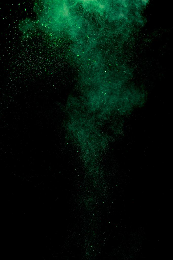 green colorful holi paint explosion on black background - Photo, Image
