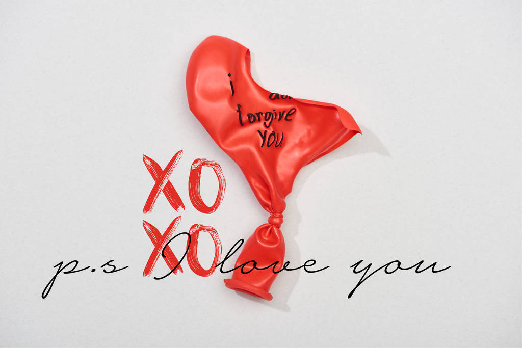 Top view of balloons with i forgive you lettering on grey background with xoxo, i love you lettering - Photo, Image