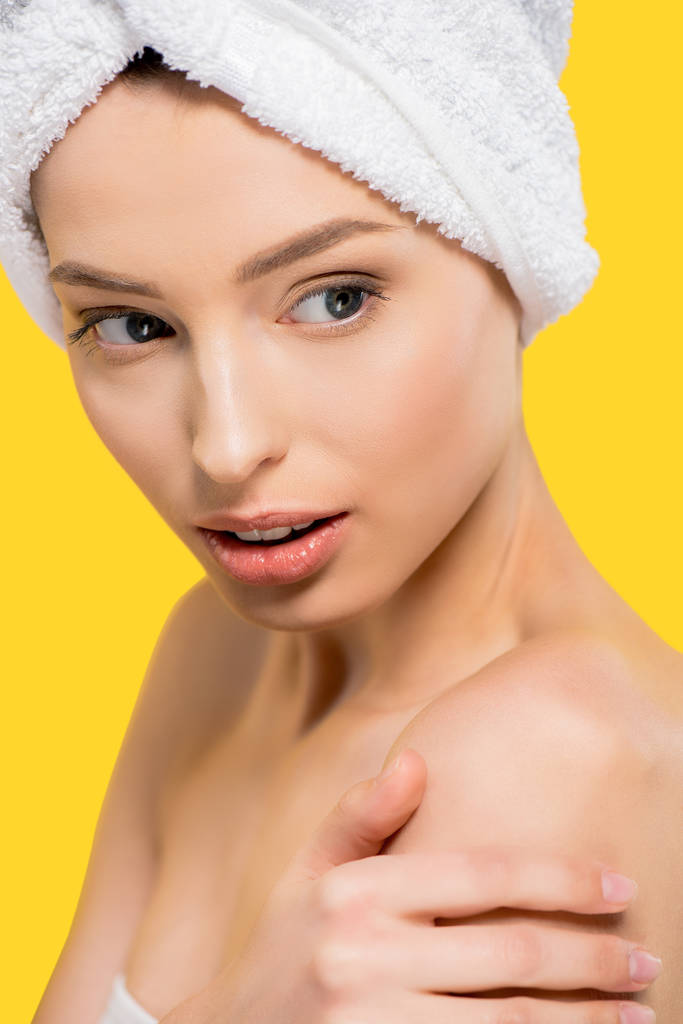 portrait of attractive girl with towel on head, isolated on yellow - Photo, Image