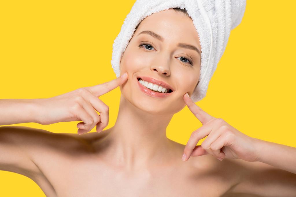 portrait of nude smiling girl with towel on head, isolated on yellow - Photo, Image