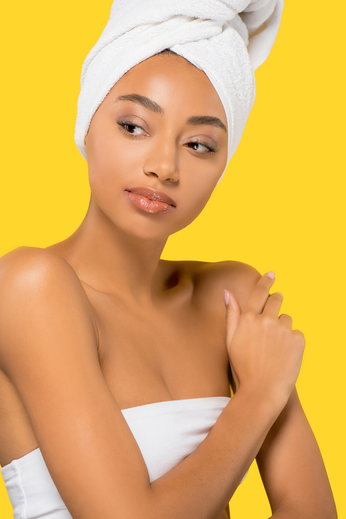 beautiful african american girl with towel on head, isolated on yellow - Photo, Image