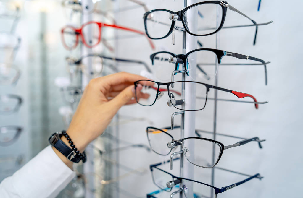 Stand with glasses in the store of optics. Eyesight correction.  - Photo, Image