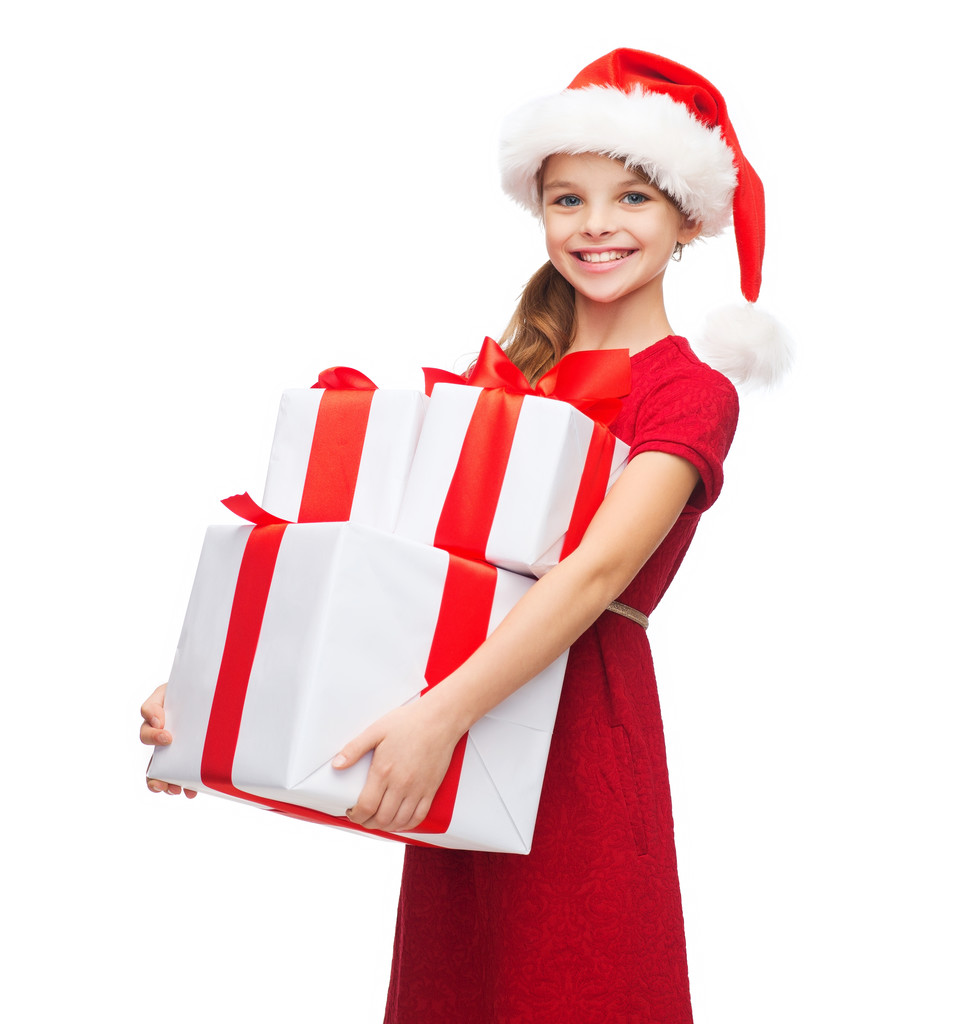 Tyttö Joulupukki auttaja hattu monia lahjapakkauksia
 - Valokuva, kuva