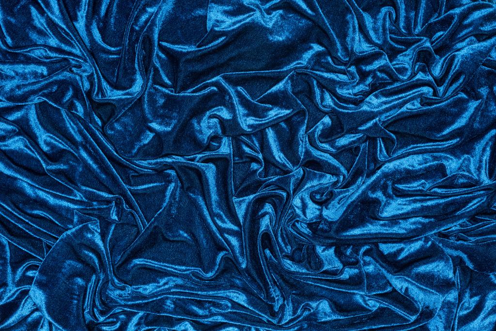 Top kilátás háttér hullámos kék ruhával - Fotó, kép
