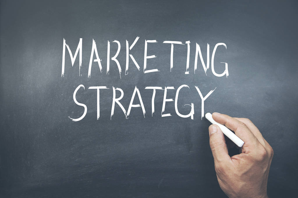 man written marketing strategy text on board - Photo, Image