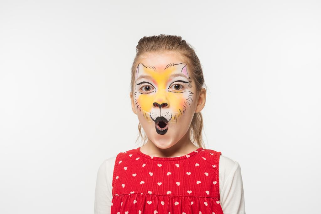portrait of adorable child with tiger muzzle painting on face looking at camera isolated on white - Photo, Image