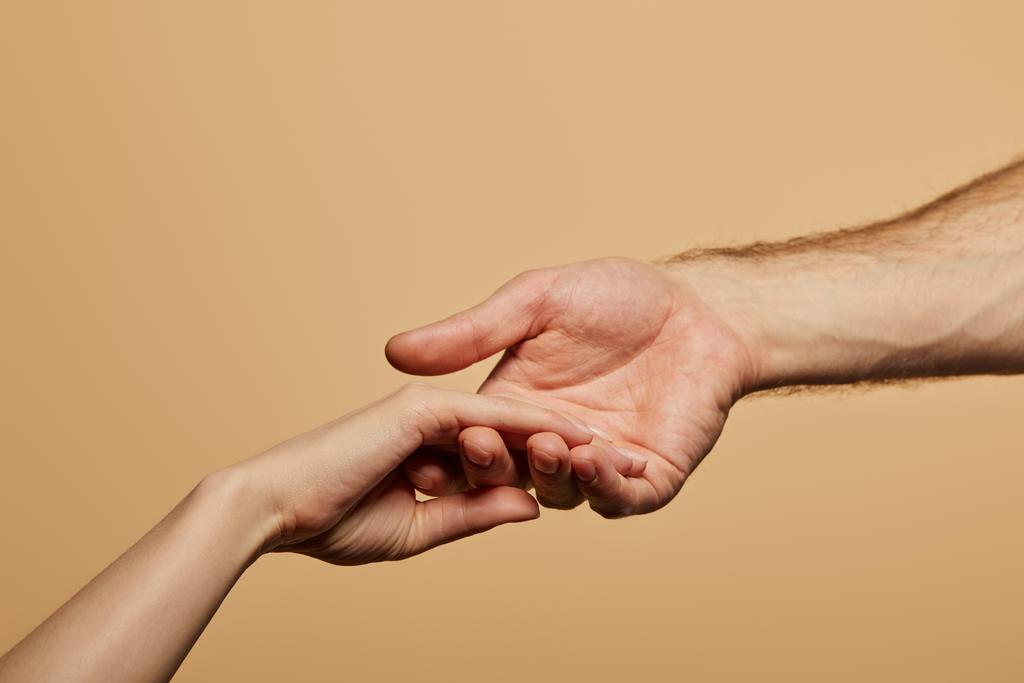 cropped view of man holding woman hand isolated on beige - Photo, Image