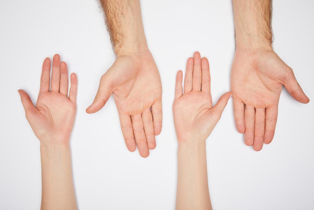 widok z góry mężczyzna i kobieta pokazując palmy izolowane na białym - Zdjęcie, obraz