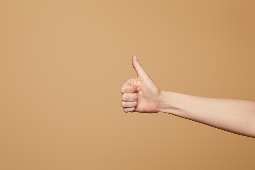 cropped view of woman showing thumb up isolated on beige - Photo, Image