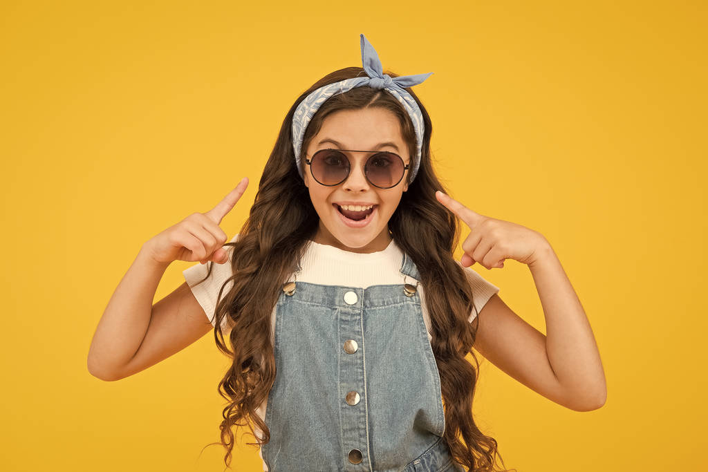 Vacation mode. Fashion trend. You can have anything you want in life if dress for it. Little fashionista. Cute kid fashion girl. Summer fashion concept. Girl long curly hair sunglasses tied headscarf - Photo, Image